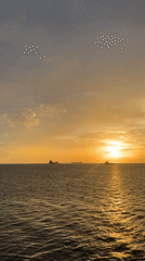 Golden sunset with three ships witnessed off Trinidad coast