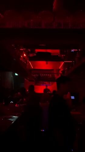 Evening scenes captured inside red-lit Dubai nightclub