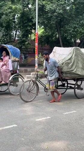 Morning street life documented across Dhaka during sunny weather