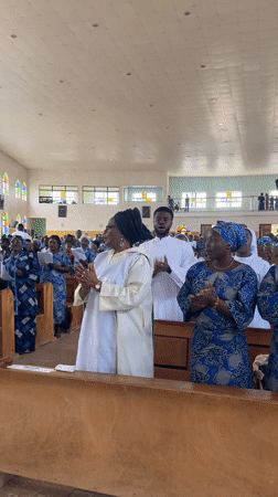 Church service in Vom, Nigeria, with congregation in prayer and song
