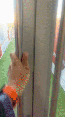 Young athlete enters stadium track in Kazan with folder
