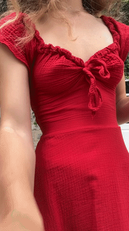 Blonde flutist performs in red dress in Budva