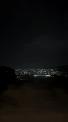 Nighttime panoramic view captured of illuminated Abuja cityscape