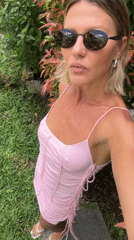 Woman poses for selfies in North Kuta garden