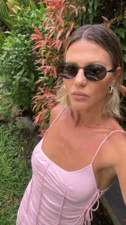 Woman poses for selfies in North Kuta garden
