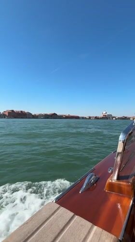 Morning boat ride captures Venice cityscape from water