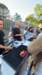 Young adults gather at historic Milan courtyard under clear skies
