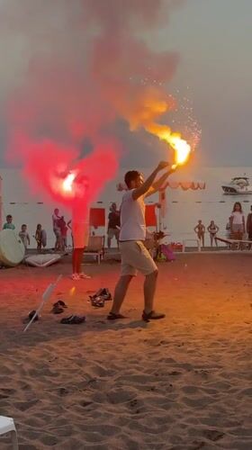 Flares light up Boreti beach at dusk in Montenegro