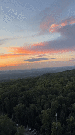 Sunset aerial views over Ufa forest hillsides