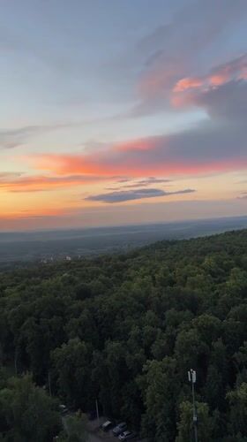 Sunset aerial views over Ufa forest hillsides