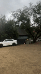 Gravel lot, locked door, and a wooden house in Blagoveshchensk