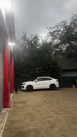 Gravel lot, locked door, and a wooden house in Blagoveshchensk