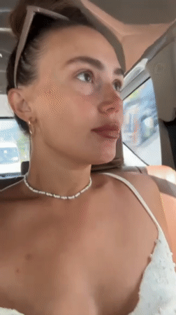 Woman photographed in moving car backseat, Phu Quoc
