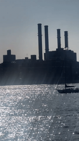 Sailboat spotted on NYC waters near industrial waterfront