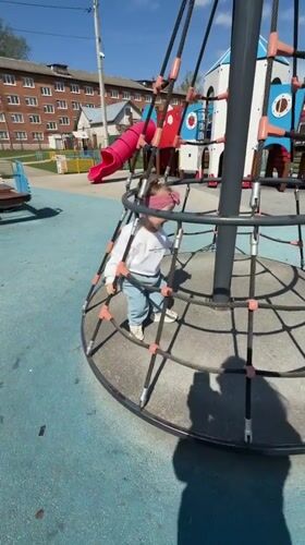Mother, child enjoy morning playground visit in Reshetnikovo