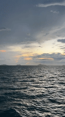 Seatran ferry cuts through Gulf of Thailand at golden hour