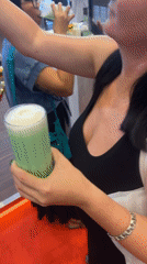 Trade show bartender serves green drinks in Kuta Selatan