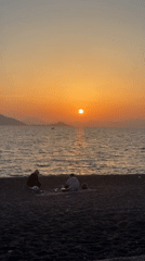 Couple enjoys sunset on Fethiye beach