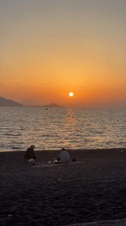 Couple enjoys sunset on Fethiye beach