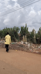 Rural street scene captured with men, motorcycles in Wang, Nigeria