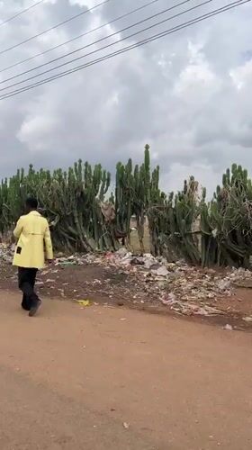 Rural street scene captured with men, motorcycles in Wang, Nigeria