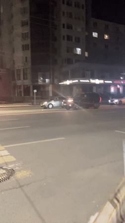Evening snapshots from a Ufa street — traffic, decor, and shops