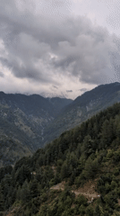 Cloudy mountain conditions documented in Naddi, India valley town