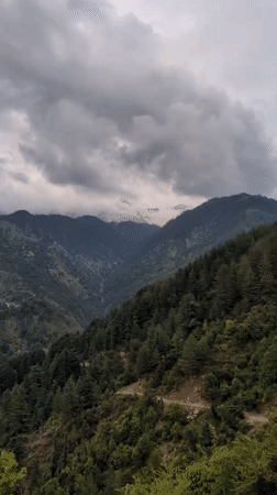 Cloudy mountain conditions documented in Naddi, India valley town