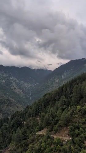 Cloudy mountain conditions documented in Naddi, India valley town