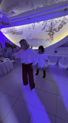 Indoor celebration with dancing and cake ceremony in Izhevsk