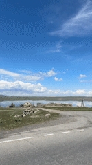 Lakeside drive captured in sunny Aghin, Armenia morning