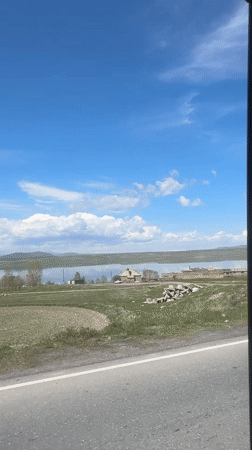 Lakeside drive captured in sunny Aghin, Armenia morning