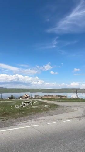 Lakeside drive captured in sunny Aghin, Armenia morning