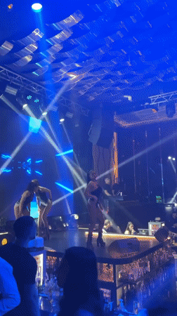 Nightclub celebration with stage performers captured by witnesses