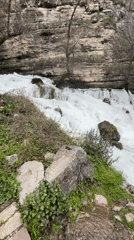 Waterfall flows over rocks near Bulgarian towns