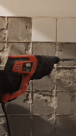 Tile demolition work during rainy weather in Hrodna