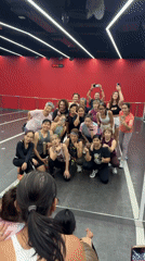 Dance group poses for photo in Thai studio