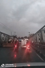 Traffic backup during road work in rainy Kruet Teumpeun