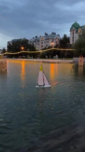 Evening at a Kazan waterfront with RC boats and a rubber duck