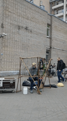 Street musician plays glass bottle xylophone in Saint Petersburg