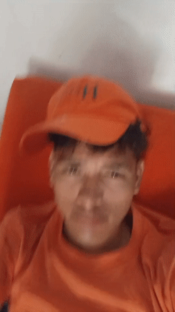 Young man in orange cap filmed at Venezuelan beach