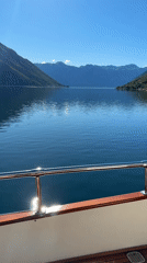 Sailboat cruises calm Montenegro waters on sunny morning