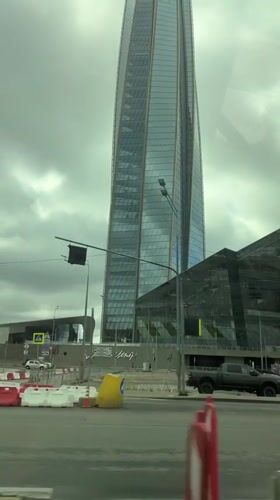 Saint Petersburg's glass skyline seen from a passing vehicle