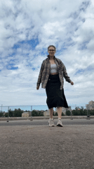 Woman photographs herself near docked ships in Shushary waterfront