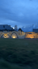 Illuminated castle amusement park captured at dusk in Poland
