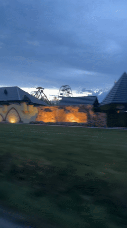 Illuminated castle amusement park captured at dusk in Poland