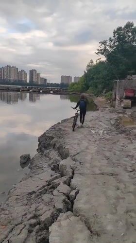 Urban exploration by a Russian waterway at sunset