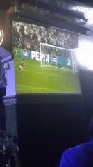 Soccer fans watch PSG-Arsenal match at Nigerian sports bar