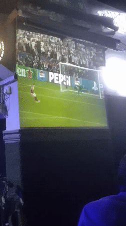 Soccer fans watch PSG-Arsenal match at Nigerian sports bar