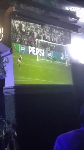 Soccer fans watch PSG-Arsenal match at Nigerian sports bar